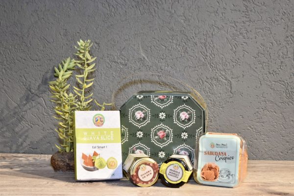 A-table-displaying-a-variety-of-snacks-and-tea-bags-featuring-the-Botanic-Hexa-brand-prominently